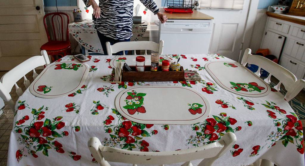 Strawberry Lady Dianna Biringers kitchen table. She and husband Mike have spent decades in the berry business. (Dan Bates / The Herald)