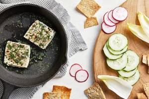 This warm, herby feta will make your guests reach for seconds