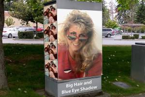 This photo illustration is a mockup of what the traffic signal box might look like for Lynnwoods Big Hair and Blue Eye Shadow photo contest to art up a box near the Alderwood mall. Thats Shannon Sessions, Lynnwood city councilwoman, in her 1988 Meadowdale High School graduation photo.                                (City of Lynnwood)