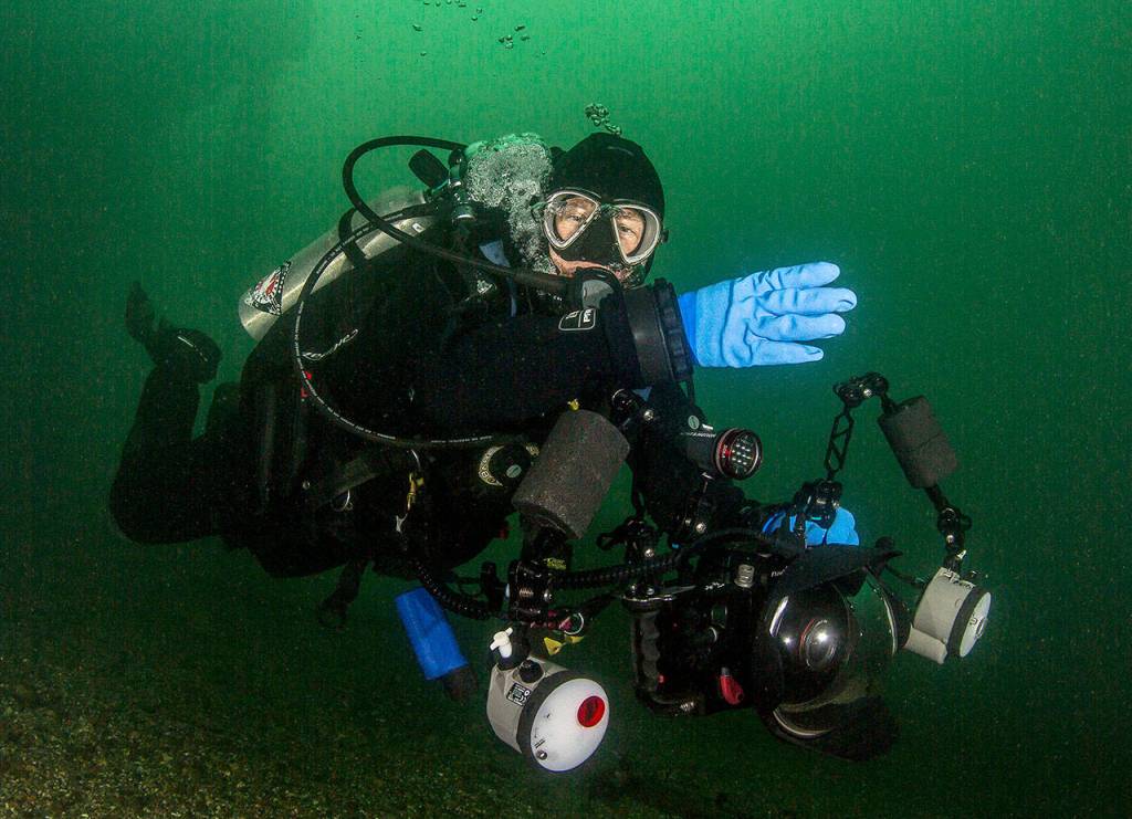 Drew Collins diving with his camera rig in 2013. (Brent Durand)