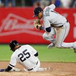 Mariners shortstop Tim Beckham (1) leaps after forcing out the Yankees Gleyber Torres (25) during the seventh inning of a game on May 7, 2019, in New York. (AP Photo/Kathy Willens)