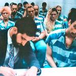 Zachary Madding (right), shortly after his 2018 arrest. (Caleb Hutton/The Herald)