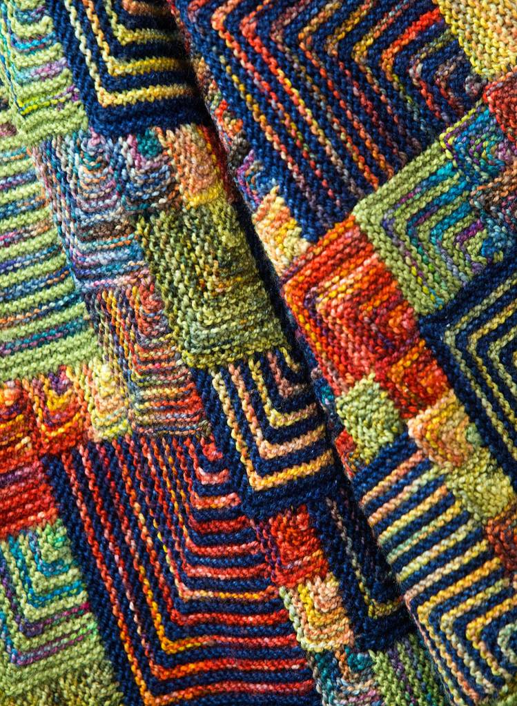 A jacket with a mitered corner square designs at the Everett shop. (Andy Bronson / The Herald)