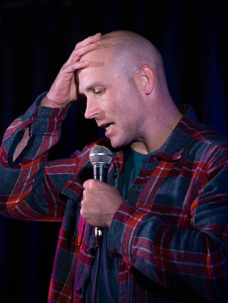 Verlon Roberts takes the stage at Comedy Garage, a weekly comedy showcase and open mic at Tony Vs Garage in Everett. (Andy Bronson / The Herald)