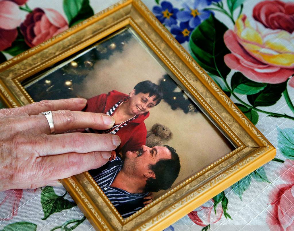 As she touches a photo of her late daughter, Kathleen Everson, Patricia Browning shares memories of her Kathy, who died in 2009. She was a love, Browning said. (Dan Bates / The Herald)