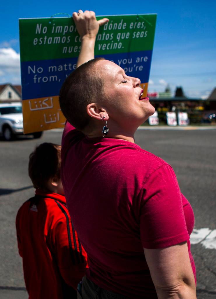 Liz Vogeli helps start a chant during the monthly <a href="https://www.heraldnet.com/news/everetts-monthly-rally-for-immigrant-rights-marches-on/" target="_blank">Solidarity March</a> on May 5 in Everett. (Olivia Vanni / The Herald)