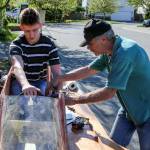 Peter Olesen (left) and Jim Tryon work to configure the throttle Wednesday afternoon. (Kevin Clark / The Herald)