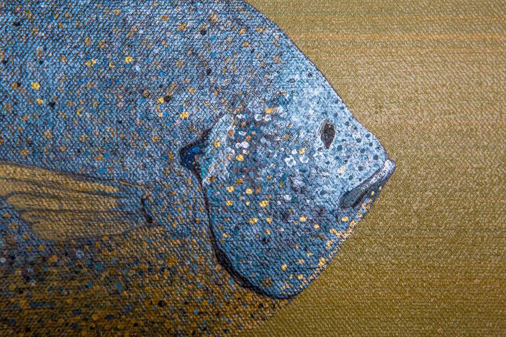 Paint used for Knutsons painting, Bluegill in the Vineyard, shines in the light. (Olivia Vanni / The Herald)
