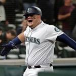 M’s overcome 5 A’s solo home runs, rally late for win