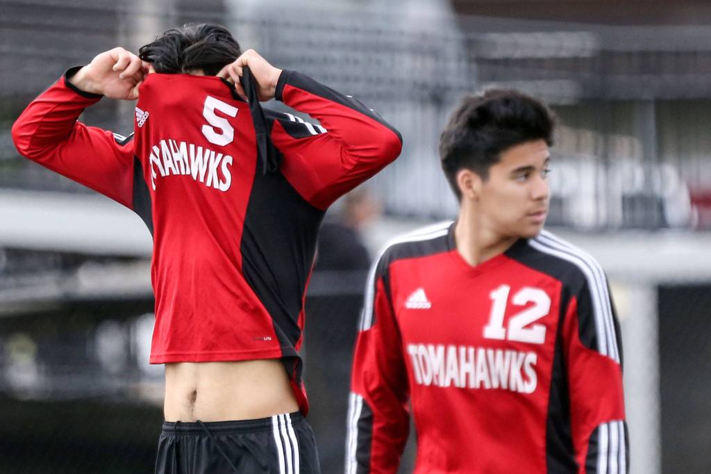 Marysville Pilchucks Carlos Macias (left) and Alex Guzman walk to the bench after the season-ending loss. (Kevin Clark / The Herald)