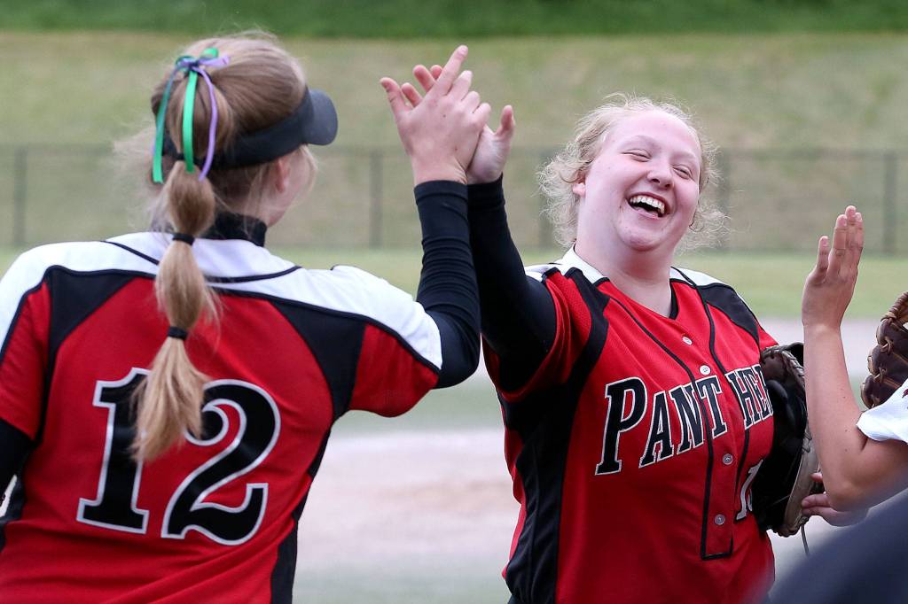 Snohomishs Elle Everett (left) and Jordan Crawford celebrate during a district playoff game against Everett on May 14, 2019, at Phil Johnson Ballfields in Everett. (Kevin Clark / The Herald)
