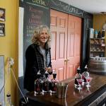 Whidbey Island Distillery spirits guide Michelle Molner pours two speciality craft cocktails for customers. The company is releasing Lavender Infused Loganberry Liqueur as part of its Savor Spring offerings. (Patricia Guthrie / Whidbey News Group)