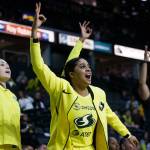 Seattles Recee Caldwell celebrates on the bench after a Storm teammate made a 3-pointer during a preseason game against Phoenix on Wednesday at Angel of the Winds Arena in Everett. (Olivia Vanni / The Herald)