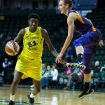 Seattles Natasha Howard dribbles around Phoenixs Stephanie Talbot during a preseason game against Phoenix on Wednesday at Angel of the Winds Arena in Everett. (Olivia Vanni / The Herald)