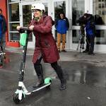 Mayor Cassie Franklin pushes off her first ride Friday morning during a launch event for an e-scooter pilot program. (Lizz Giordano / The Herald)
