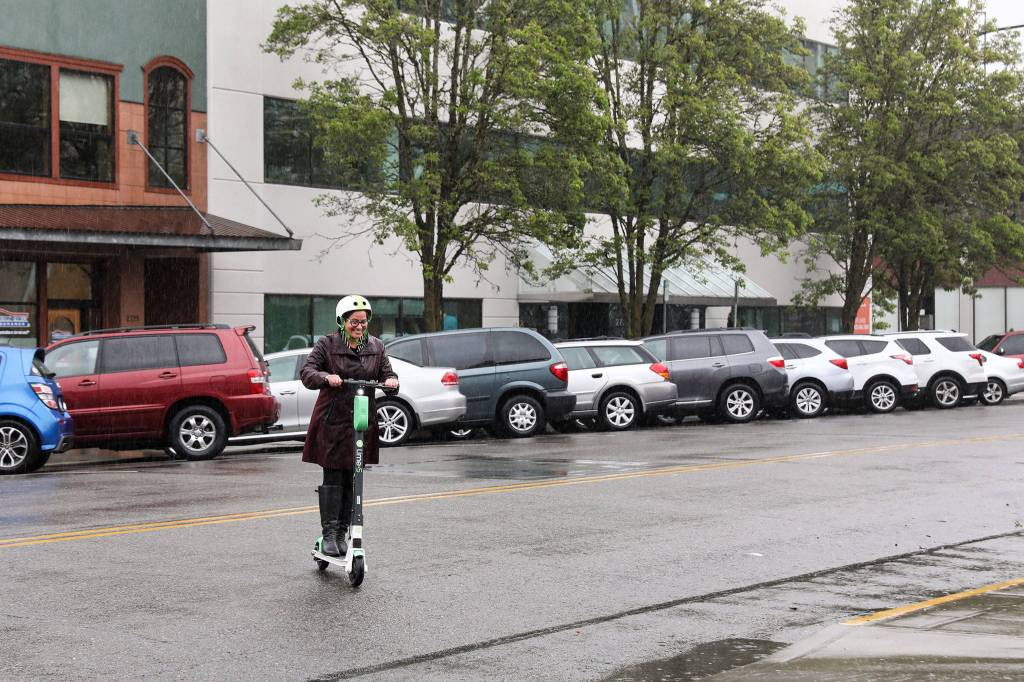 Mayor Cassie Franklin returns from her e-scooter inaugural ride Friday morning. (Lizz Giordano / The Herald)