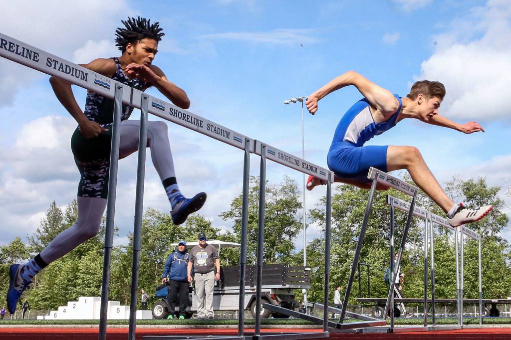 Shorewood junior Jonathan Birchman claimed a trio of 3A district titles, winning both hurdles events and the high jump. (Kevin Clark / The Herald)