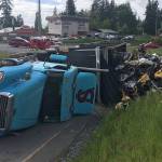 Semi tips over on Highway 99, spills 100 gallons of diesel