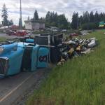 A semi-truck crashed and spilled 100 gallons of diesel on the Highway 99 on-ramp to Highway 525. (Washington State Patrol)