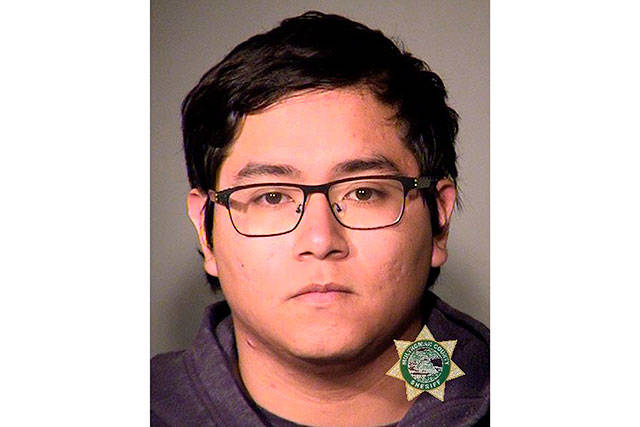 This undated photo provided by the Portland, Ore., Police Bureau on Saturday shows Angel Granados Diaz, 18. Police said the Parkrose High School student was tackled after reportedly bringing a gun into a classroom on Friday. (Portland Police Bureau via AP)