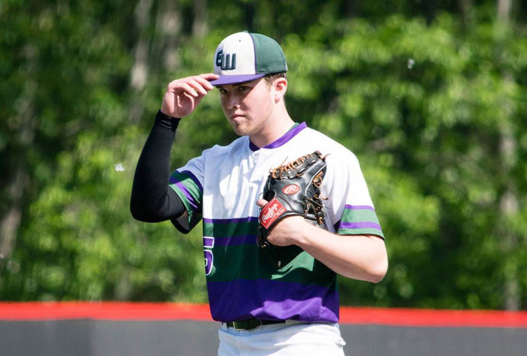 Edmonds-Woodway pitcher Ian Michael adjusts his cap on the mound during a 3A state playoff game against Mountain View on May 18, 2019, at Bannerwood Park in Bellevue. (Katie Webber / The Herald)