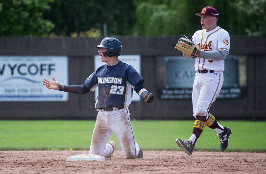 Arlingtons Jack Sheward reacts after being called out at second base after a rundown. (Andy Bronson / The Herald)