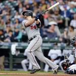 The Twins C.J. Cron hits a solo home run off Mariners starting pitcher Wade LaBlanc during the second inning of a game on May 18, 2019, in Seattle. (AP Photo/John Froschauer)