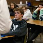 High school freshmen listen to Wexford County prosecutor Jason Elmore talk about consent and criminal sexual conduct April 17 in Cadillac, Michigan. Among other things, he reminded them that the legal age of consent for sexual contact in the state of Michigan is 16. Most of the students in these classes are younger than that. (AP Photo/Martha Irvine)