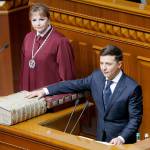 Ukrainian President-elect Volodymyr Zelenskiy swears on the Bible as he takes the oath of office during his inauguration ceremony in Kiev, Ukraine, on Monday. (AP Photo/Efrem Lukatsky)
