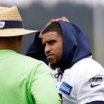 Seahawks linebacker Bobby Wagner (right) talks with defensive coordinator Ken Norton Jr. during a practice on May 21, 2019, in Renton. (AP Photo/Elaine Thompson)