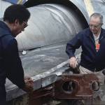 William Schaefer of American Airlinesc (right) and Elwood Driver of the National Transportation Safety Board (left) examine the engine that fell off the DC-10 in Chicago on May 26, 1979, the day after the worst aviation disaster in the nations history. Reporters take notes behind Schaefer. (AP Photo/Fred Jewell, file)