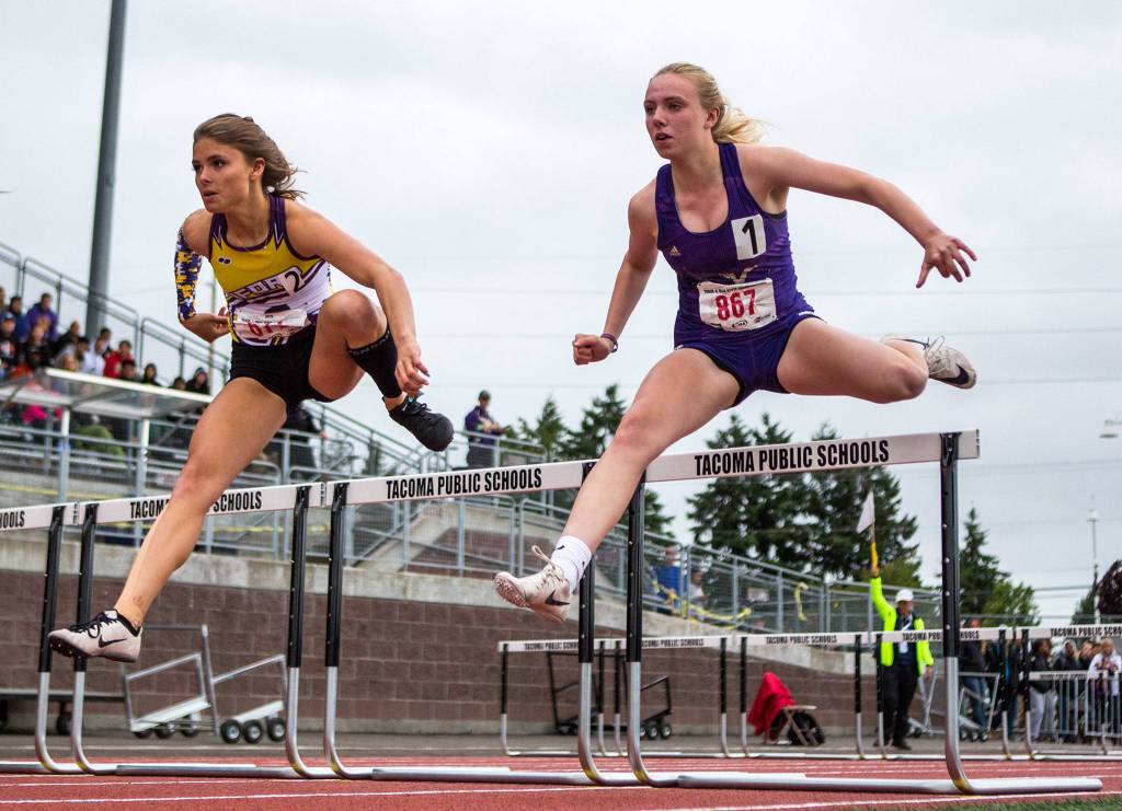 Lake Stevens Chloe Pattison clears a hurdle during the second day of competition at the 4A/3A/2A State Track Field Championships on Friday at Mount Tahoma High School in Tacoma. (Olivia Vanni / The Herald)