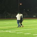 Jacksons Minhyok Kim (right) is consoled by coach Sarah Smart after the Timberwolves lost to Puyallup 4-0 in a 4A state semifinal match Friday at Sparks Stadium in Puyallup. (Nick Patterson photo)