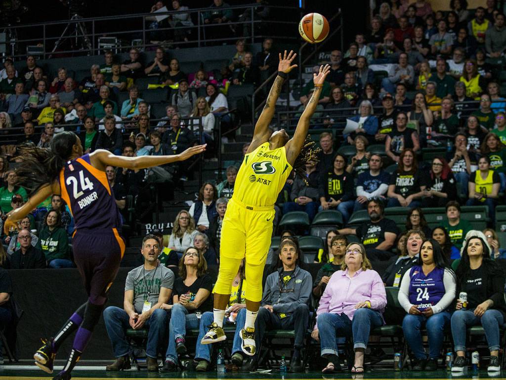 Seattle Storms Shavonte Zellous jumps for a high pass during the season opener game against the Phoenix Mercury on Saturday, May 25, 2019 in Everett, Wash. (Olivia Vanni / The Herald)