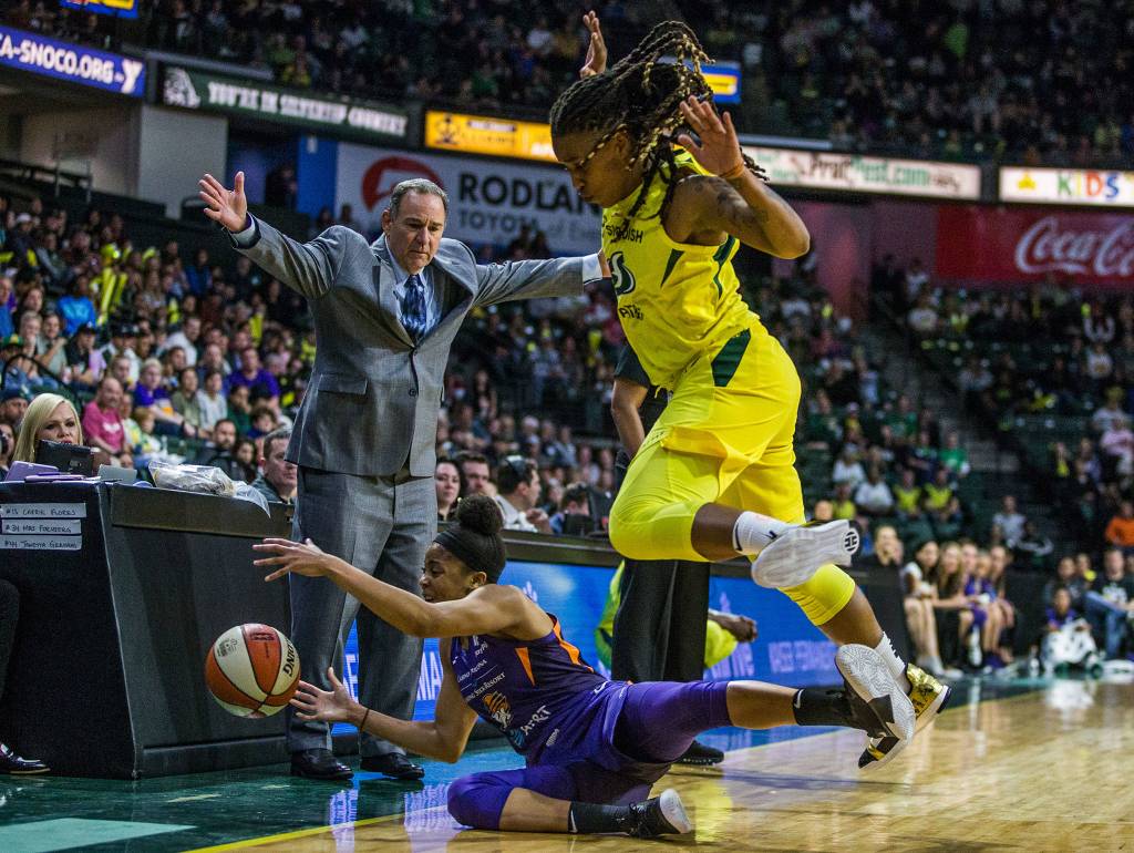 Seattle Storms Shavonte Zellous scrambles for the ball with Phoenix Mercurys Arica Carter during the season opener game against the Phoenix Mercury on Saturday, May 25, 2019 in Everett, Wash. (Olivia Vanni / The Herald)