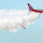 The Boeing 747-400 Global SuperTanker drops half a load of its 19,200-gallon capacity during a ceremony at Colorado Springs, Colorado, in 2016. (Christian Murdock/The Gazette via AP, File)
