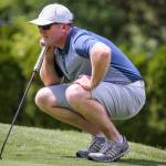 Jacob Rohde check his sight line Sunday afternoon during the second round of the Snohomish County Amateur Golf Tournament at Harbour Pointe Golf Club in Mukilteo on May 26, 2019. Rohde took the first place with 4-under-par 70. (Kevin Clark / The Herald)