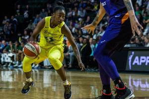 The Seattle Storms Jewell Loyd dribbles around the Phoenix Mercurys Brittney Griner during the season opener on Saturday, May 25, 2019 in Everett, Wash. (Olivia Vanni / The Herald)