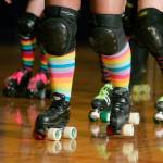Jet City Roller Derby skaters show their colors while warming up at practice at the Everett Skate Deck. The roller derby league is hosting a comedy show and silent auction in Everett on June 8. (Herald file)