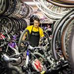 Tony Simonelli gathers a bike for a tune up on May 30 at Sharing Wheels Community Bike Shop in Everett. (Kevin Clark / The Herald)