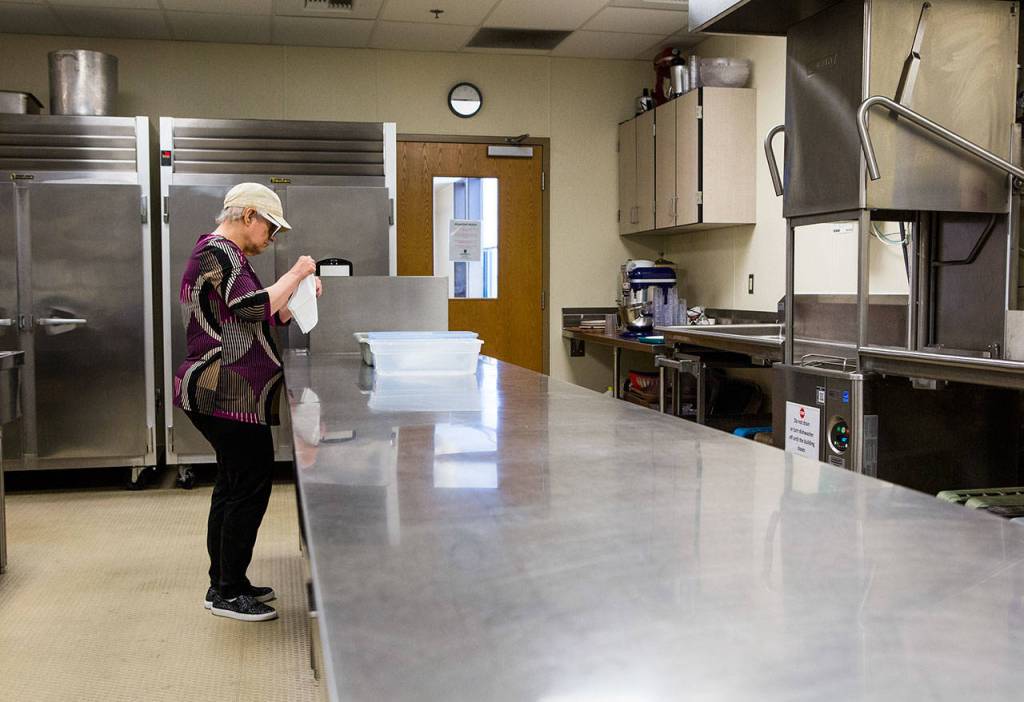 Curry is able to do most of her volunteering without any help and has reduced her napkin rolling time to one roll per minute. (Olivia Vanni / The Herald)