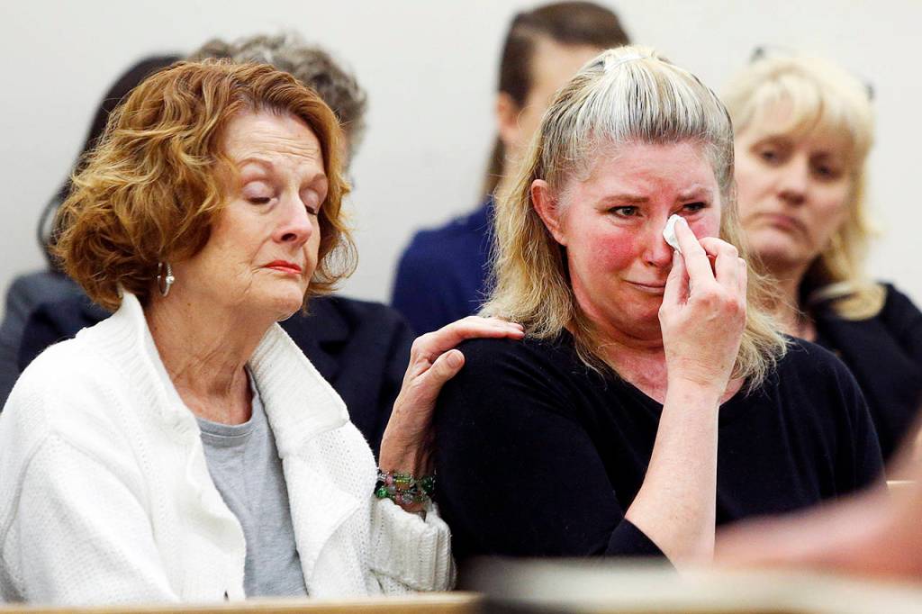 Brenda Welch (right) listens to the 2016 sentencing of her ex-husband, David Morgan, for his attempted murder of her at his Lynnwood home on Nov. 16, 2014. Morgan was sentenced to more than 21 years for fracturing Welchs skull and setting her on fire. (Ian Terry / Herald file)