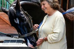 Dr. Suzanne Poppemas horse, Lochinvar takes a treat from her hand, Friday at a Snohomish riding facility where she keeps him and rides him regularly. Poppema, 71, was an abortion provider before retiring five years ago. She has been a long-time advocate for womens access to abortion. She is worried about rights currently threatened. (Dan Bates / The Herald)
