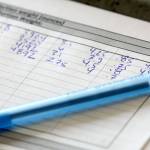 Measurements are recorded from salmon samples at the labs of NSF International in Everett. (Kevin Clark / The Herald)