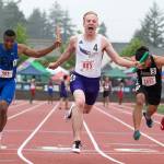 Lake Stevens Matthew Zehrung cheers as he crosses the finish line to give the Vikings state a title in the Boys 4x100 meter relay at Mount Tahoma Stadium on May 25 in Tacoma. (Andy Bronson / The Herald)