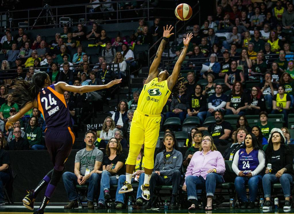 Seattle Storms Shavonte Zellous jumps for a high pass during the season opener game against the Phoenix Mercury on May 25 in Everett. (Olivia Vanni / The Herald)