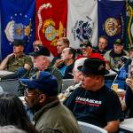 At the Heros Cafe in Lynnwood, more than 100 people listen to Michael Reagan, a veteran of the war in Vietnam. (Dan Bates / The Herald)