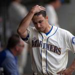 Seattle Mariners starting pitcher Marco Gonzales walks through the dugout after being pulled from Sundays game against the Los Angeles Angels. (AP Photo/Stephen Brashear)