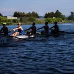 A patch of sunlight illuminates Andrew McCartney during the Everett Rowing Associations varsity 8 boats May 31 practice on the Snohomish River in Everett. (Olivia Vanni / The Herald)