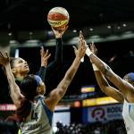 The Storms Alysha Clark shoots over two Lynx defenders. (Andy Bronson / The Herald)